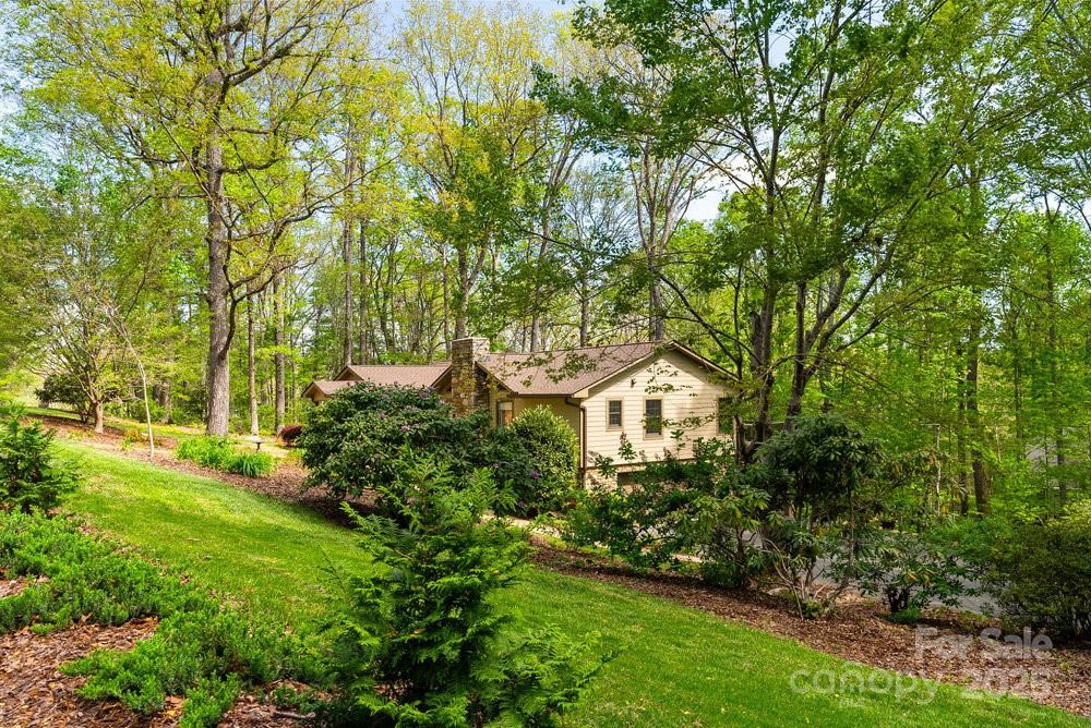 83 Lovers Loop Road Asheville, NC 28803 - Photo 43 of 44 a front view of a house with garden