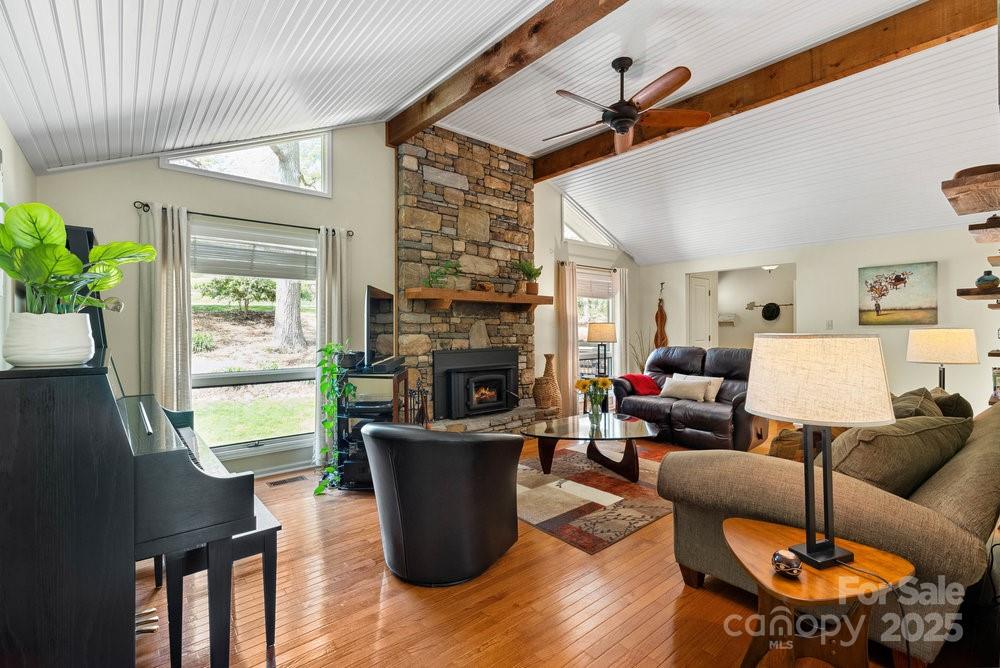 83 Lovers Loop Road Asheville, NC 28803 - Photo 10 of 44 a living room with furniture a fireplace and a potted plant