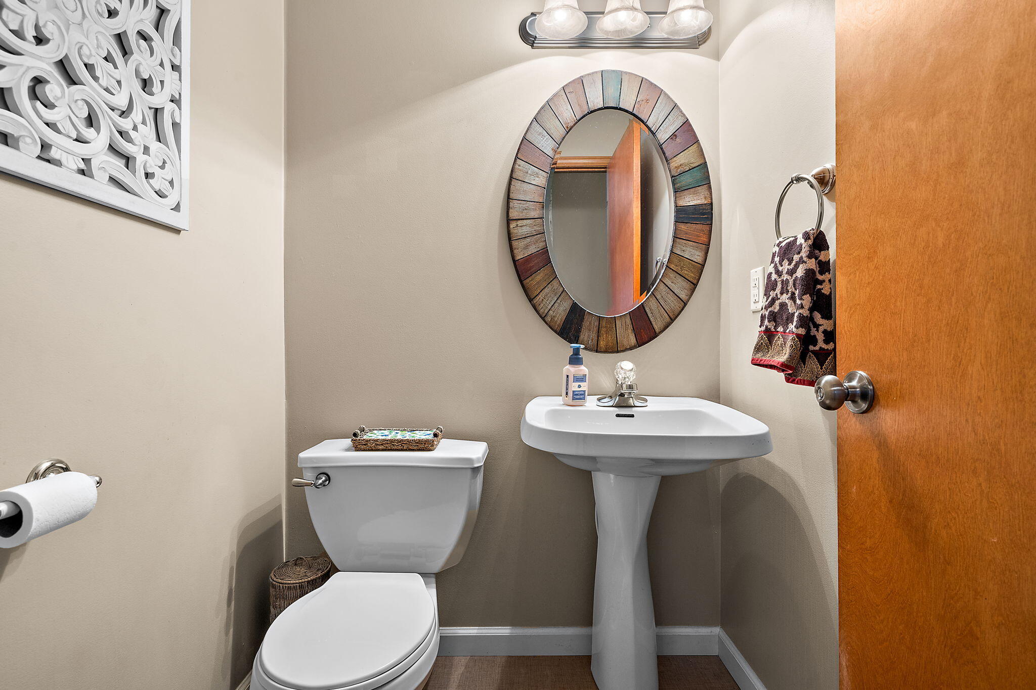 412 Chessington Drive Crown Point, IN 46307 - Photo 13 of 30 a bathroom with a toilet a sink and a mirror