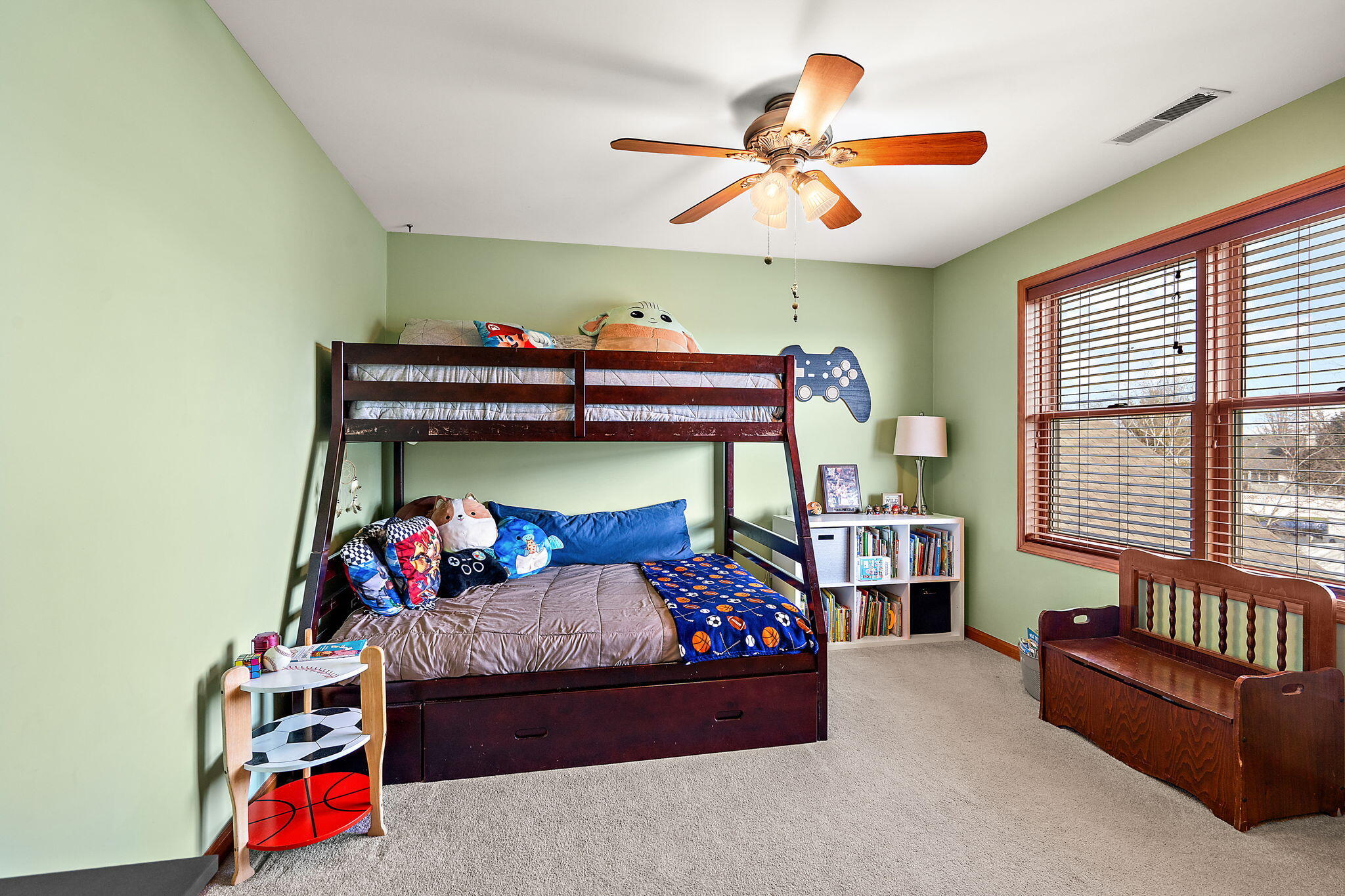 412 Chessington Drive Crown Point, IN 46307 - Photo 17 of 30 a bedroom with a bed and a chandelier