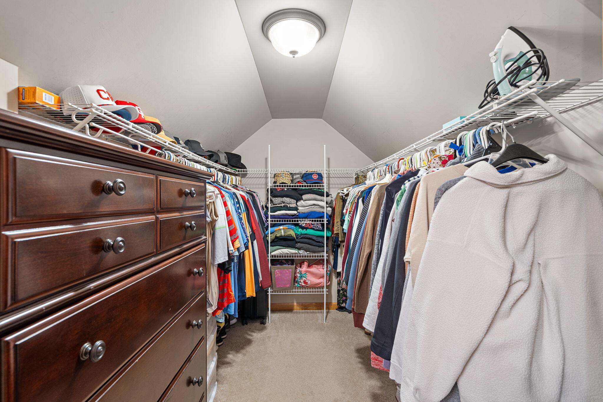 412 Chessington Drive Crown Point, IN 46307 - Photo 19 of 30 a view of walk in closet with clothes and shoes
