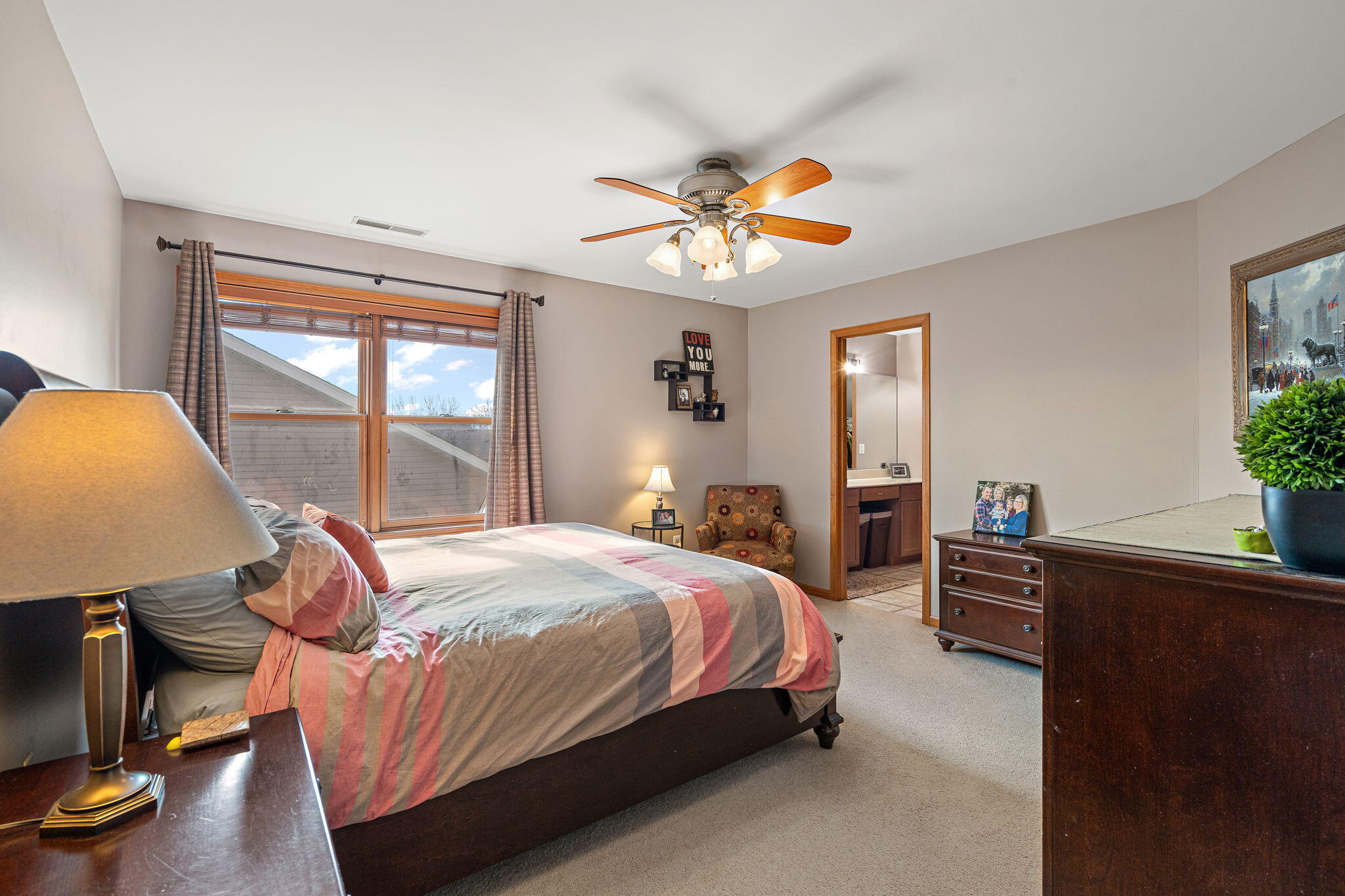 412 Chessington Drive Crown Point, IN 46307 - Photo 21 of 30 a bedroom with a bed and dresser with wooden floor
