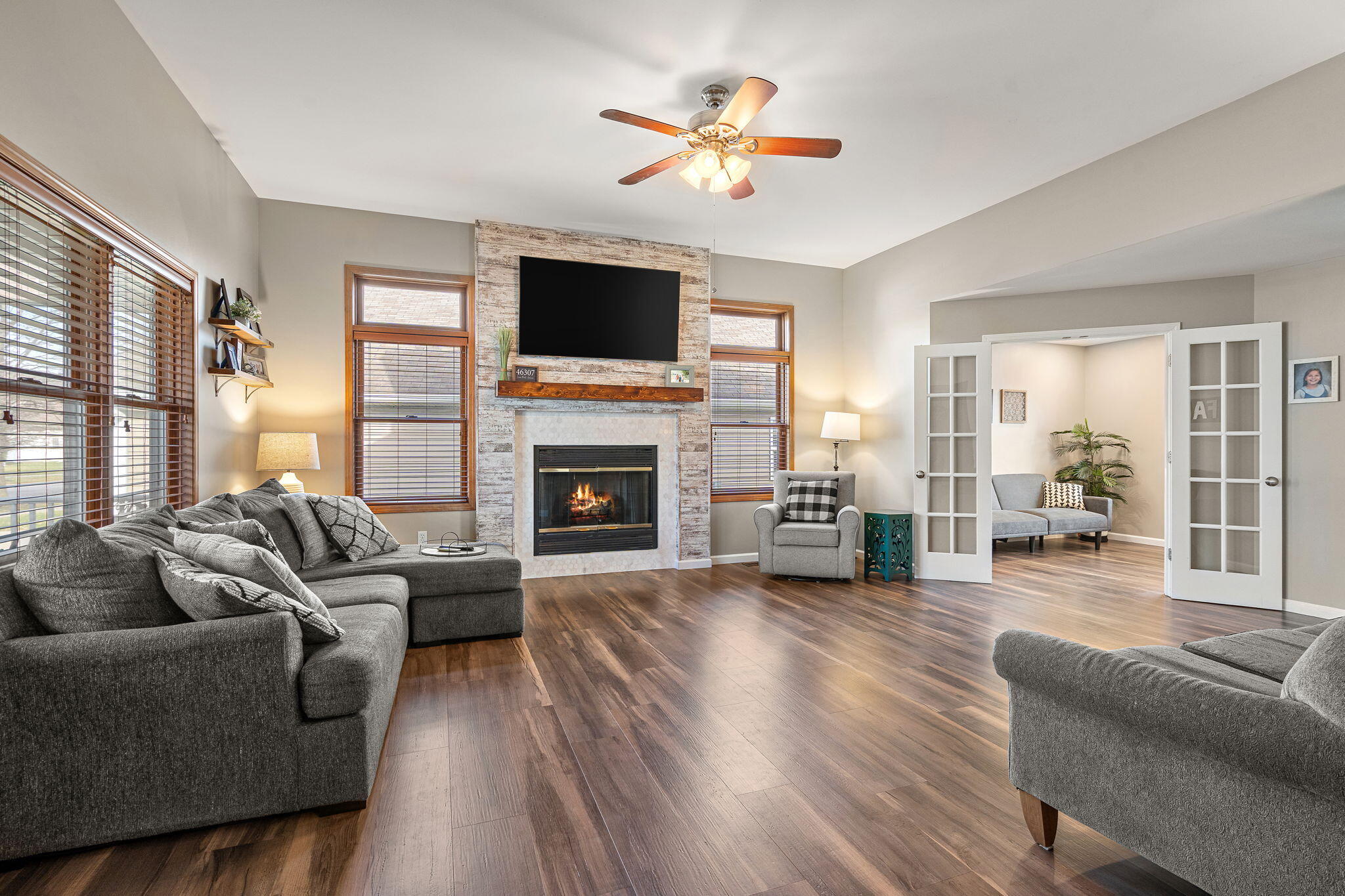 412 Chessington Drive Crown Point, IN 46307 - Photo 9 of 30 a living room with furniture fireplace and a flat screen tv