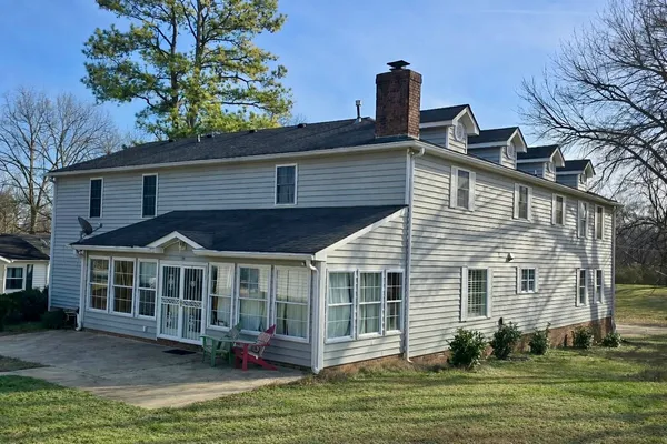 a view of a house with a yard