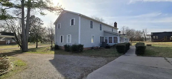a view of a yard in front of a house with a big yard