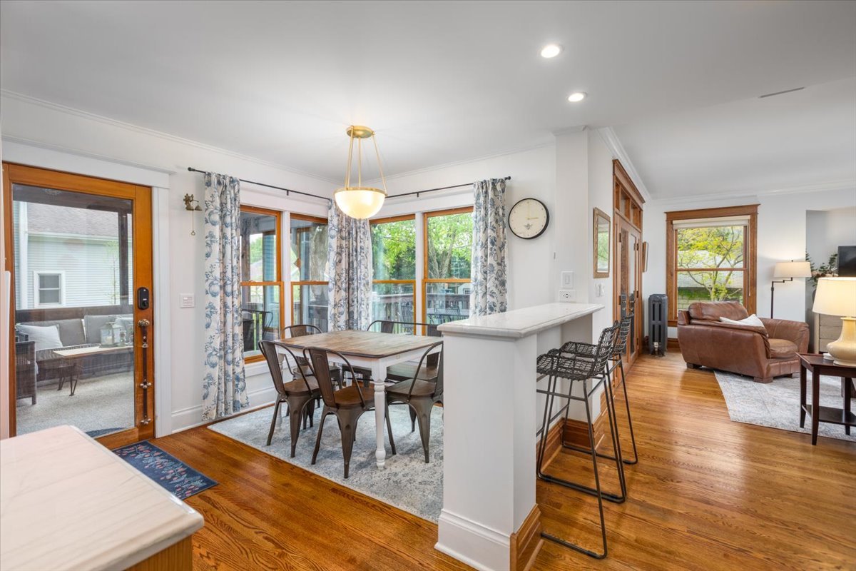 23 Columbia Street Naperville, IL 60540 - Photo 27 of 94 a view of a dining room with furniture window and wooden floor