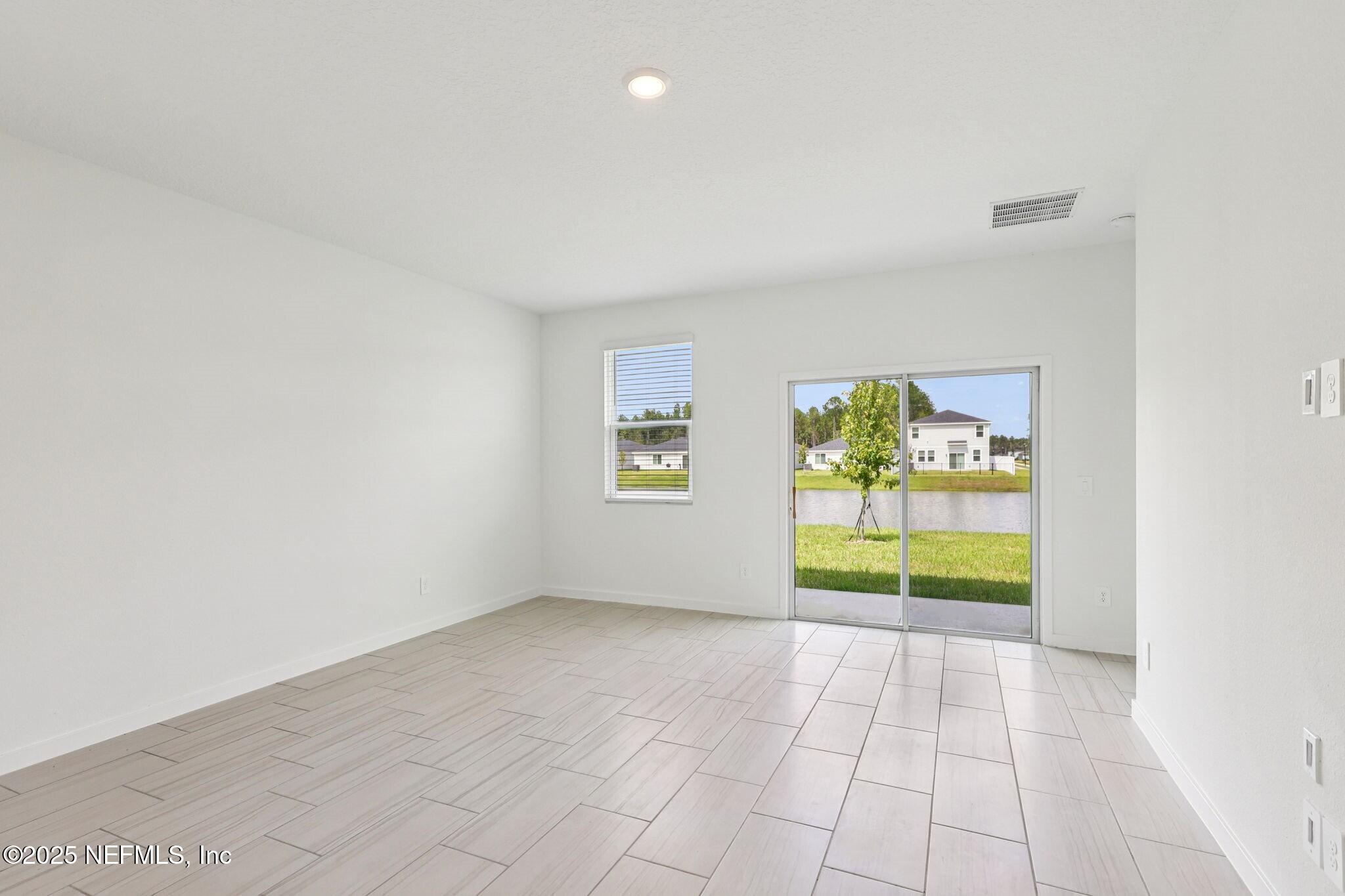 9638 Cypress Mdws Road Jacksonville, FL 32219 - Photo 12 of 35 a view of an empty room with a window