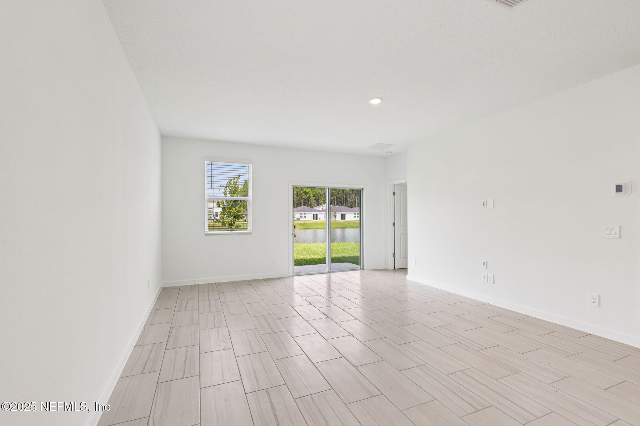 9638 Cypress Mdws Road Jacksonville, FL 32219 - Photo 14 of 35 an empty room with windows