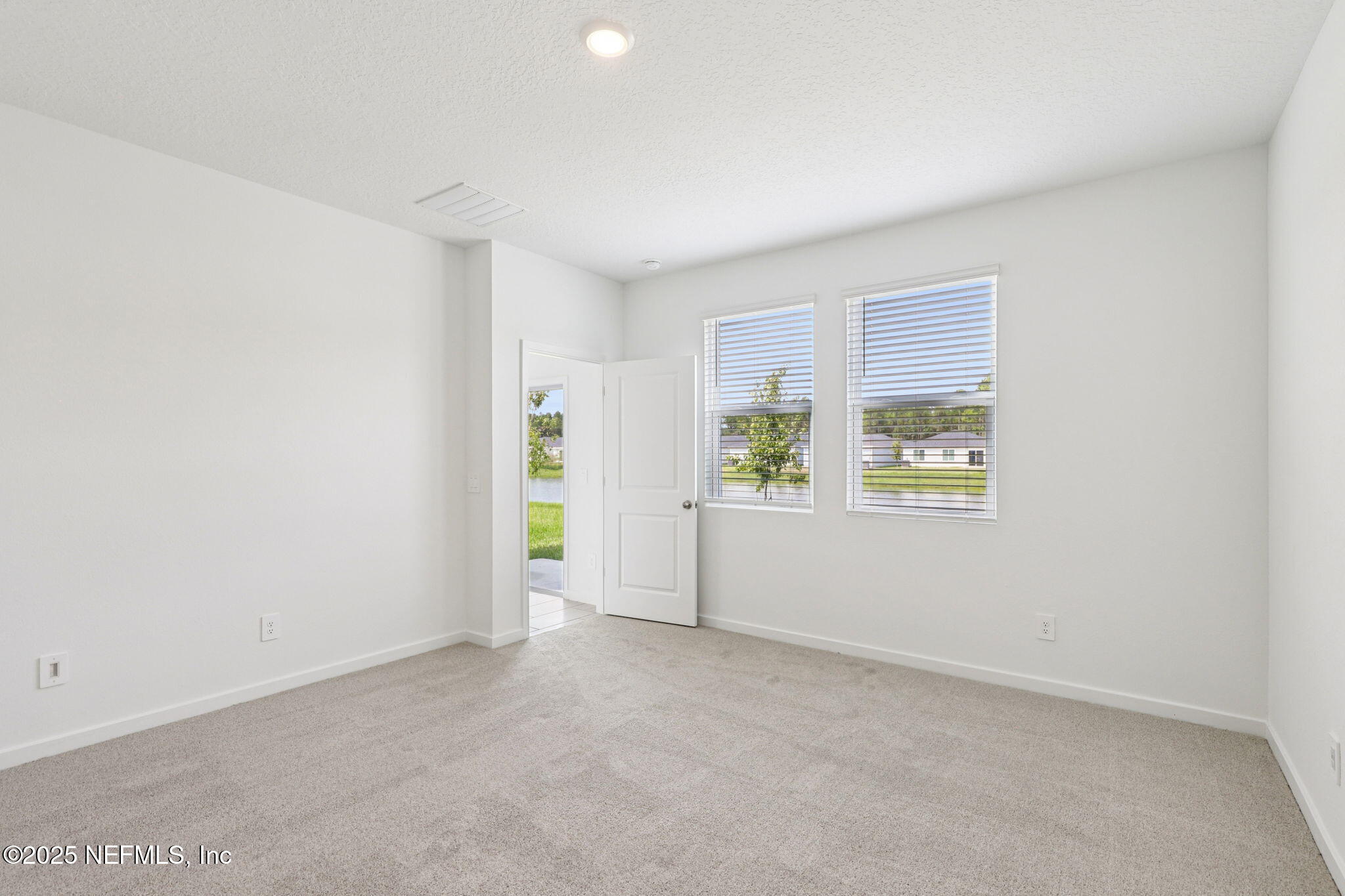 9638 Cypress Mdws Road Jacksonville, FL 32219 - Photo 20 of 35 an empty room with window and stairs