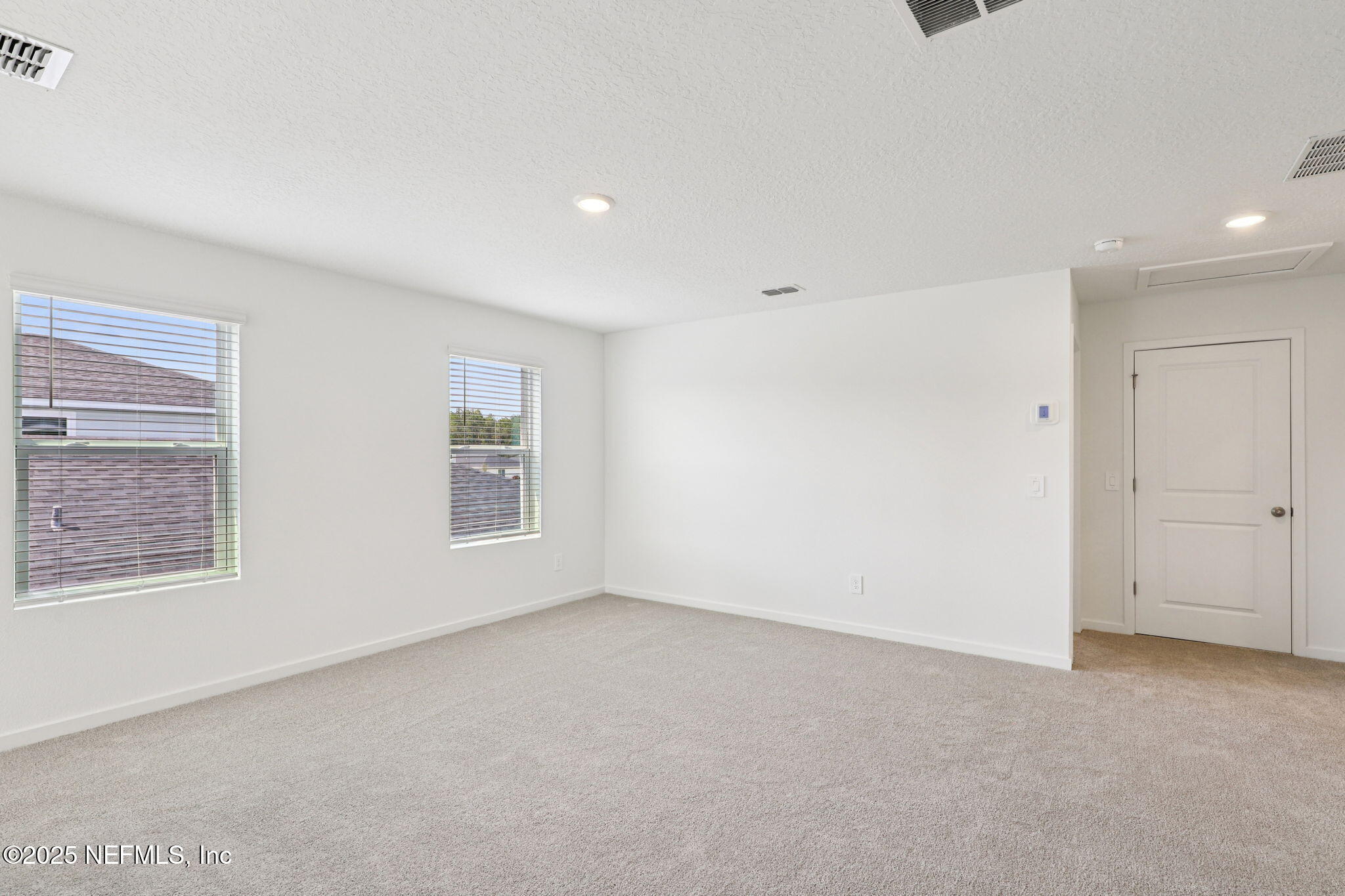 9638 Cypress Mdws Road Jacksonville, FL 32219 - Photo 27 of 35 a view of an empty room with a window