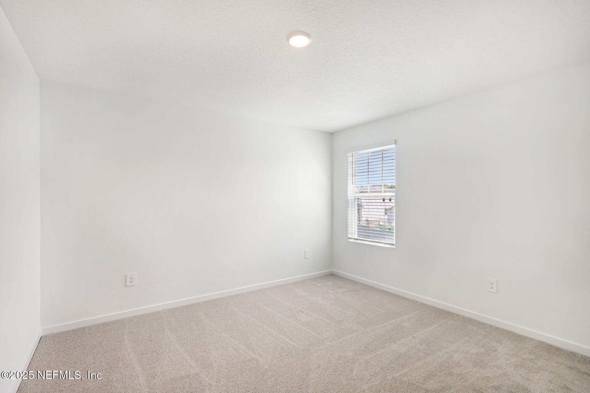 9638 Cypress Mdws Road Jacksonville, FL 32219 - Photo 28 of 35 a view of an empty room and a window