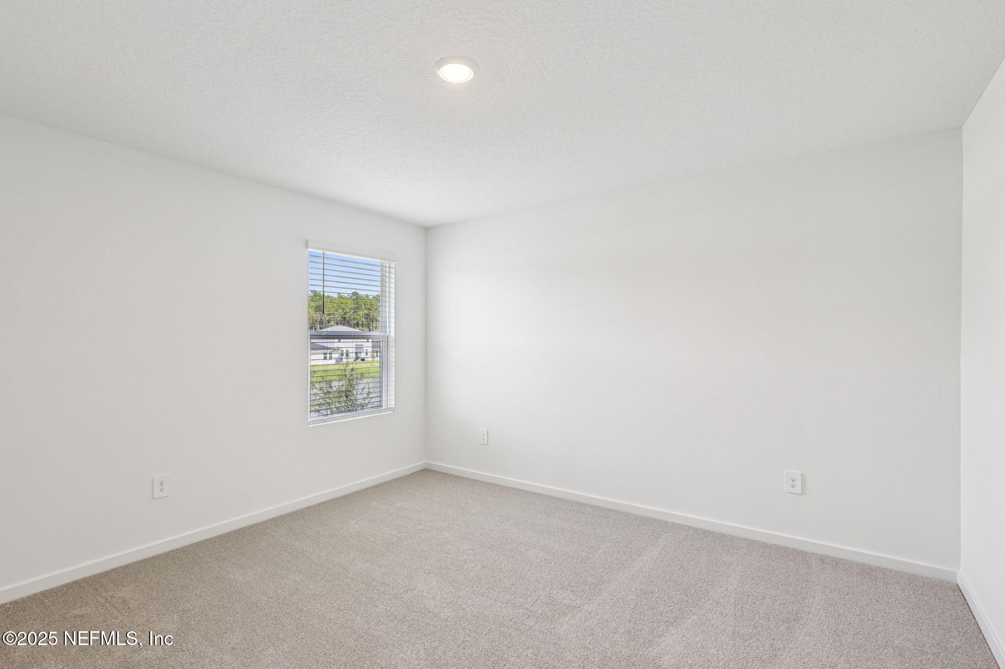 9638 Cypress Mdws Road Jacksonville, FL 32219 - Photo 31 of 35 an empty room with a window