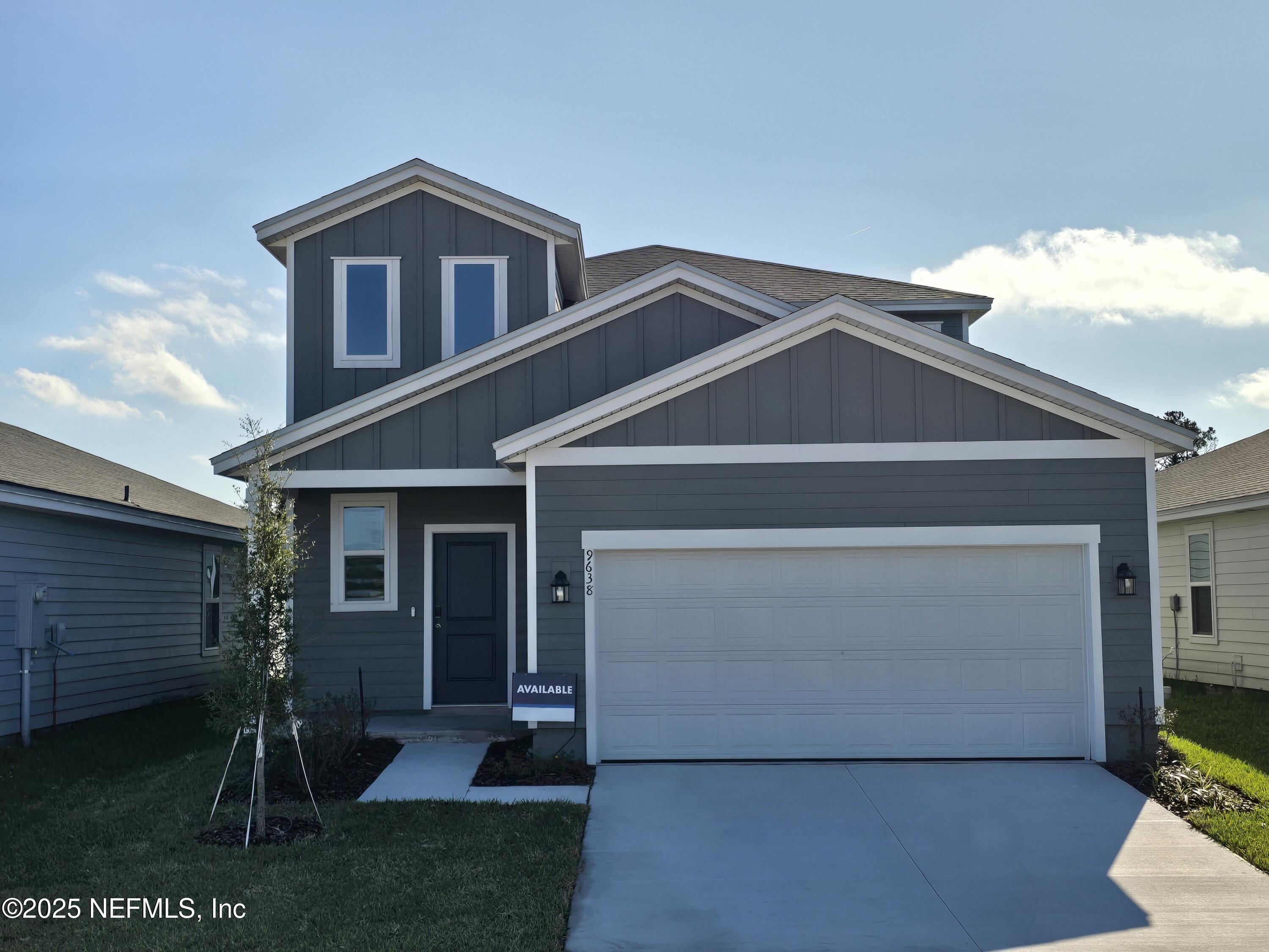 9638 Cypress Mdws Road Jacksonville, FL 32219 - Photo 34 of 35 a front view of a house with a yard