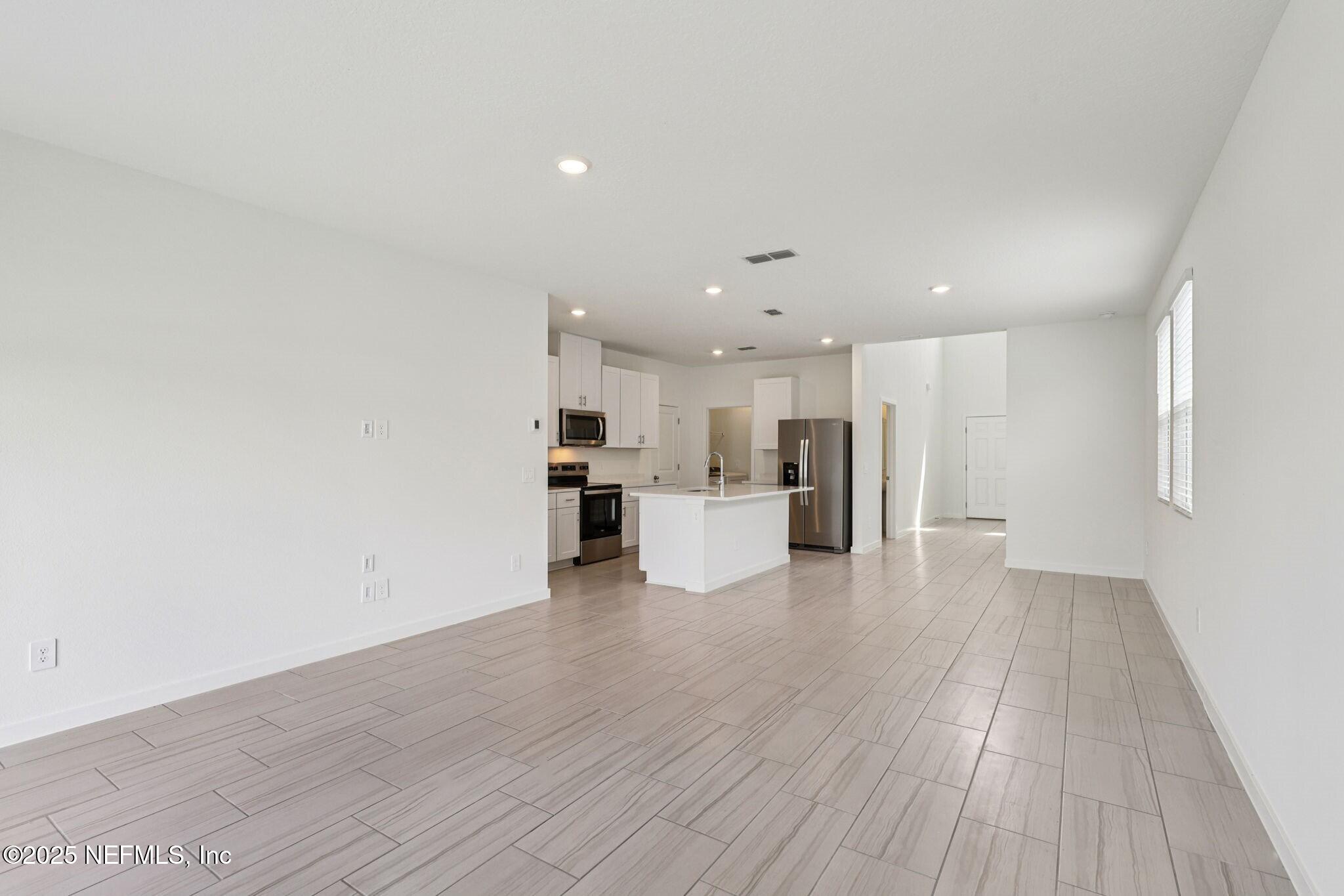 9638 Cypress Mdws Road Jacksonville, FL 32219 - Photo 6 of 35 a view of kitchen with wooden floor