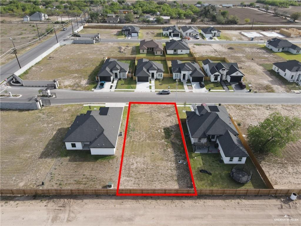 804 Magnolia Street Mission, TX 78573 - Photo 2 of 2 an aerial view of a yard with horses