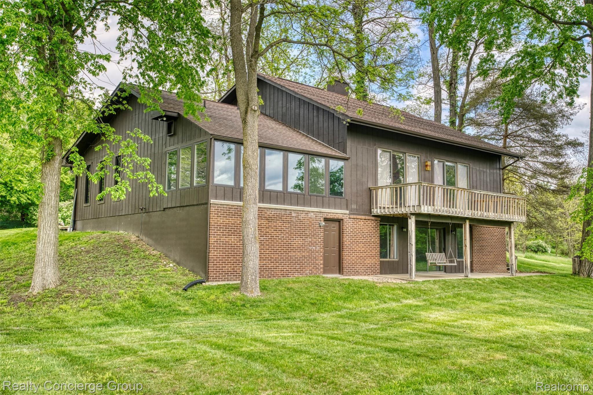 2110 East Clyde Road Howell, MI 48855 - Photo 26 of 44 This wood & brick contemporary home is stunning from every angle