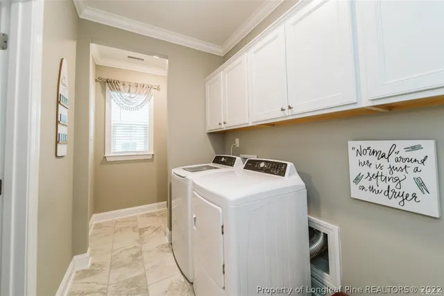 a kitchen with lots of counter top space and cabinets