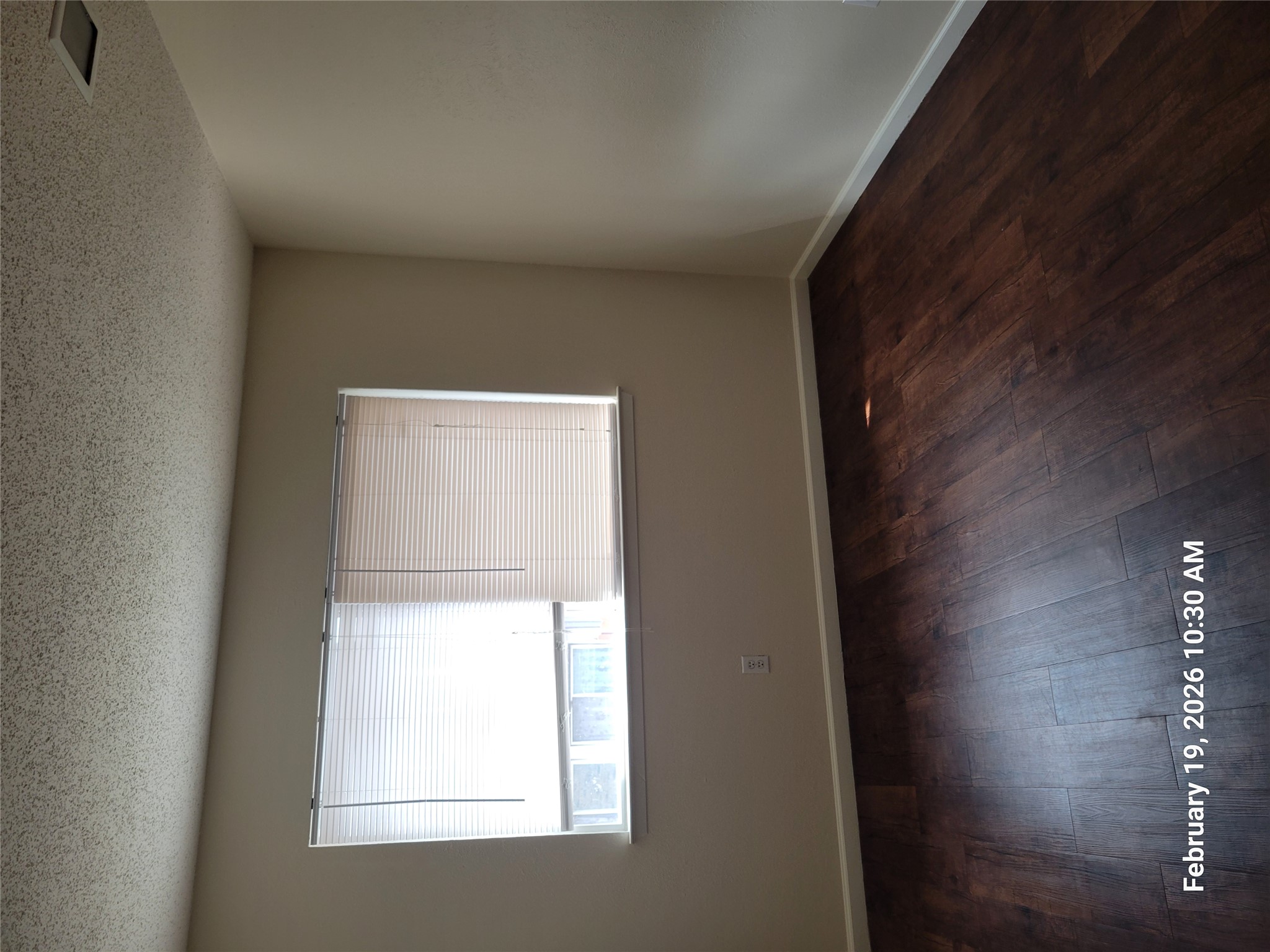 7266 Coronado Circle Austin, TX 78752 - Photo 9 of 11 Unfurnished room featuring a textured ceiling and dark wood-style floors