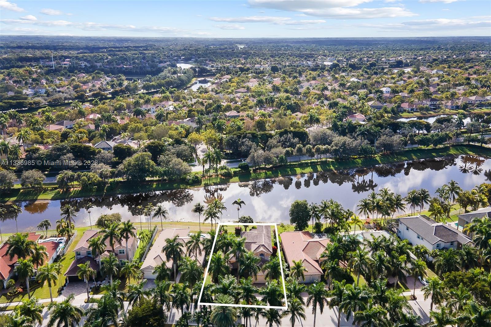 948 Windward Way Weston, FL 33327 - Photo 3 of 46 an aerial view of residential houses with outdoor space and trees