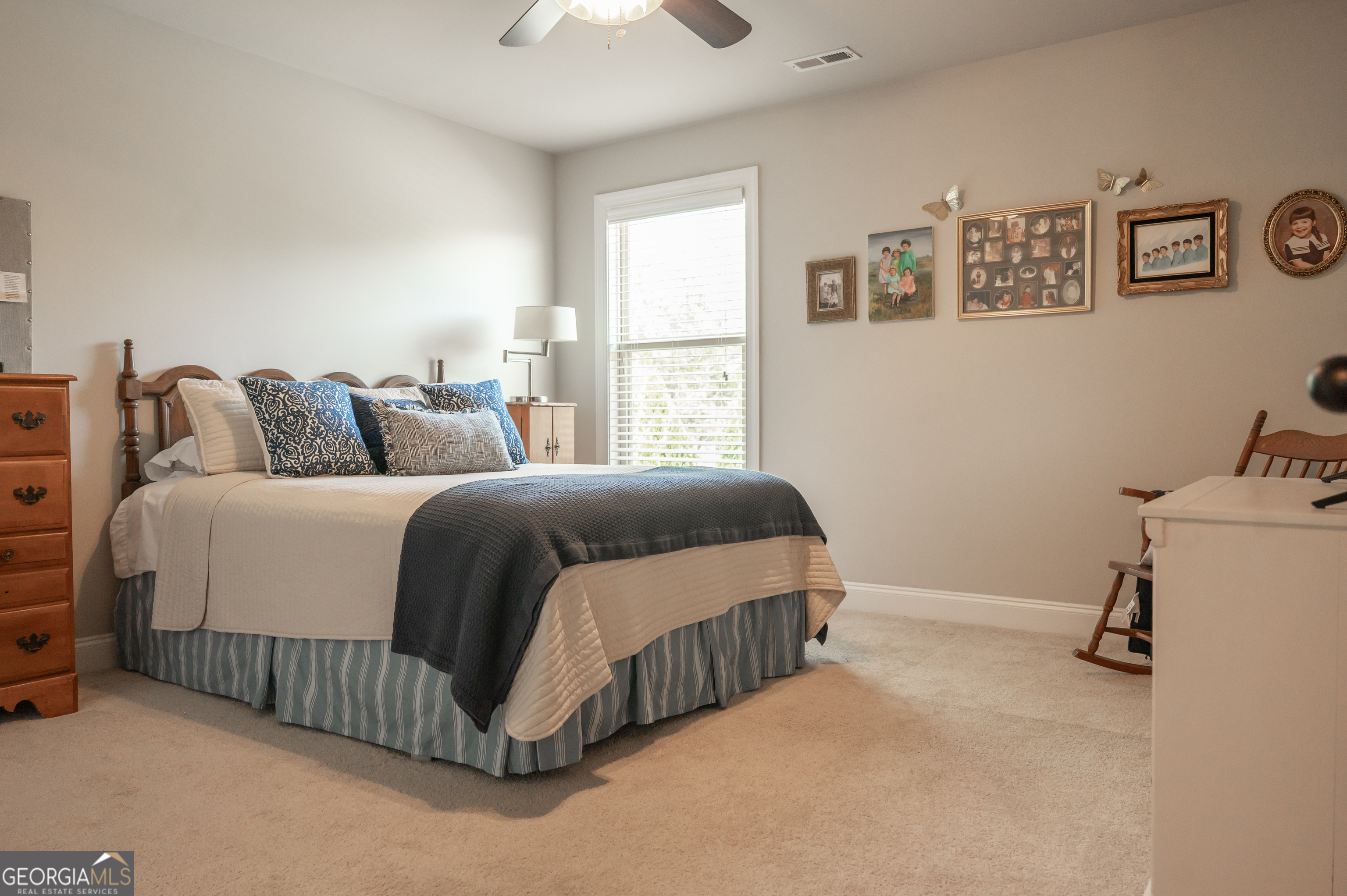 415 EAS Way Fayetteville, GA 30215 - Photo 41 of 70 a bedroom with a bed and a dresser