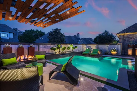 a view of a patio with a table and chairs