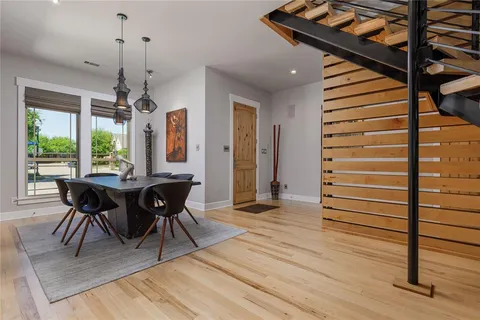a dining room with furniture and window
