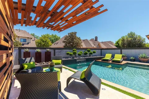 a view of an outdoor sitting area with furniture