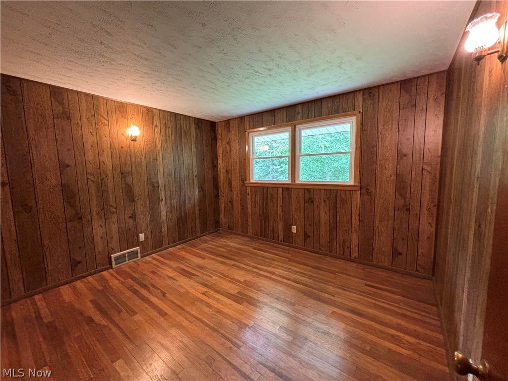 7595 Webster Road Cleveland, OH 44130 - Photo 26 of 45 Bedroom 2 features hardwood floors, large windows and a large closet