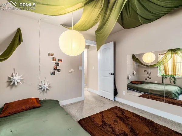 a bedroom with a bed and a mirror
