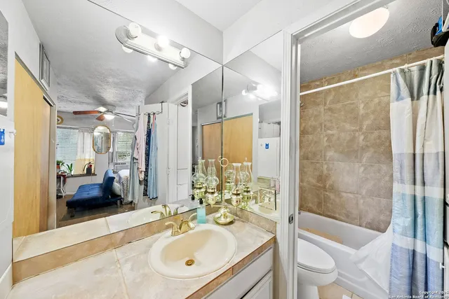 a en suite spacious bathroom with a double sink shower and a mirror