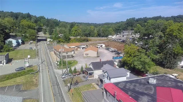 an aerial view of a house with outdoor space