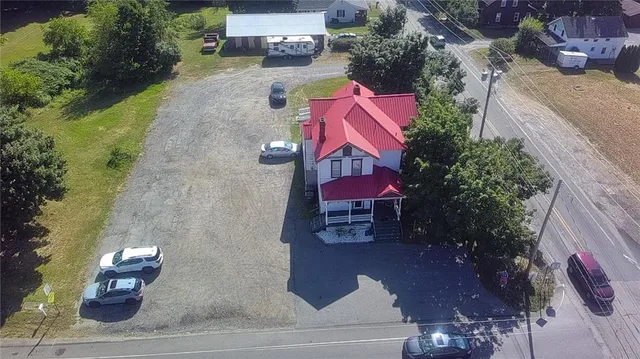 an aerial view of houses with yard