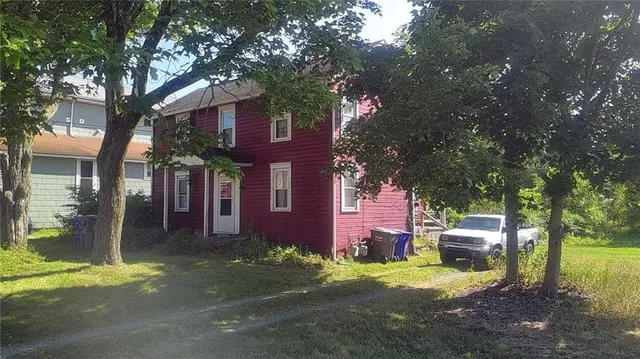 a front view of a house with a yard