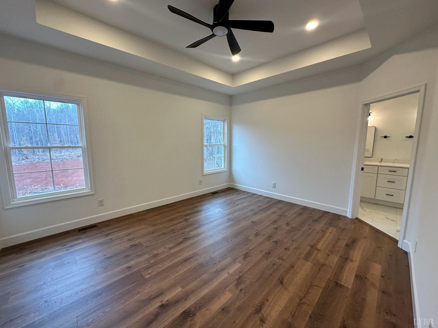 11314 Leesville Road Evington, VA 24550 - Photo 13 of 28 a view of empty room with wooden floor and window