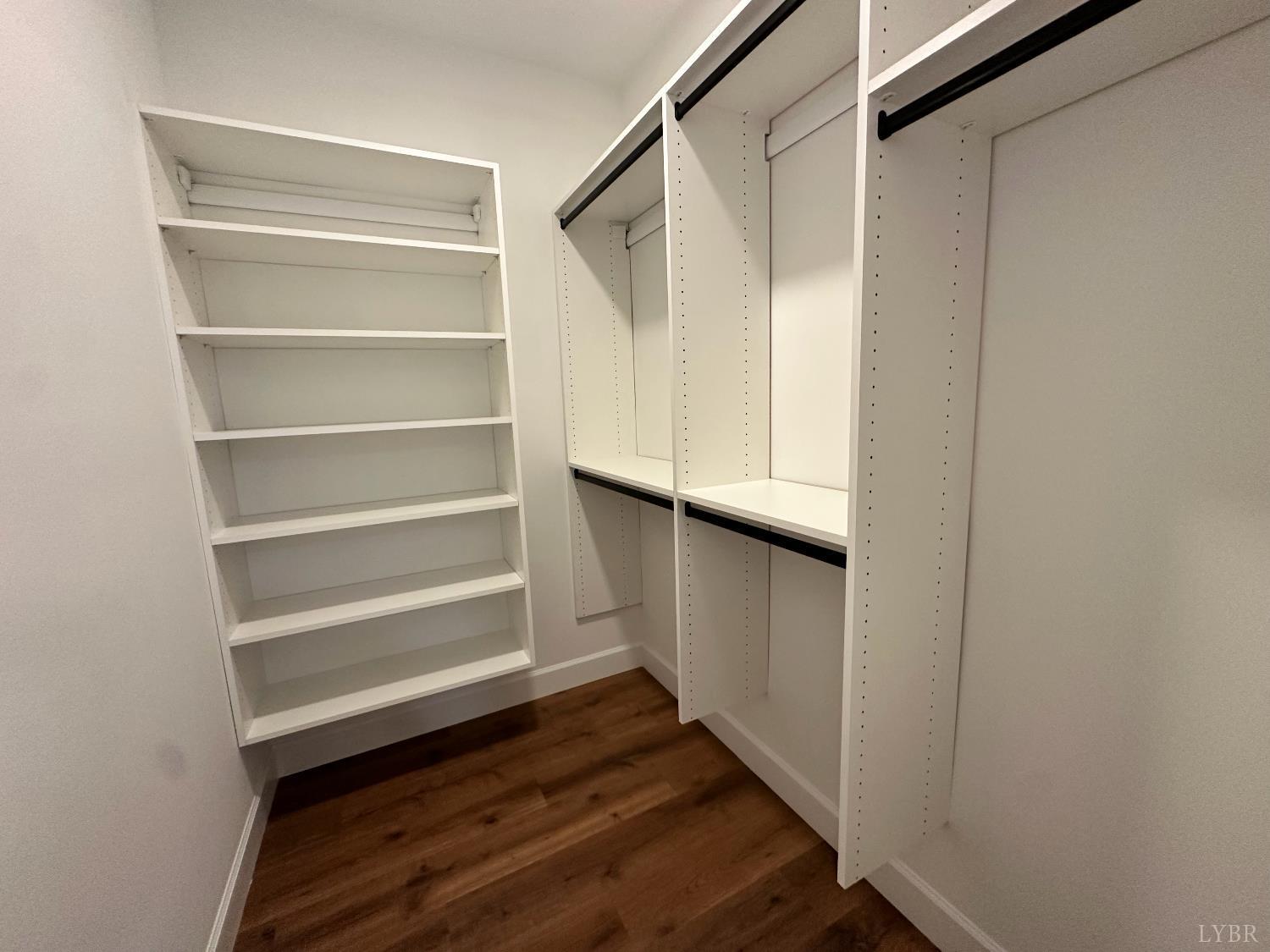 11314 Leesville Road Evington, VA 24550 - Photo 16 of 28 a view of walk in closet with empty racks