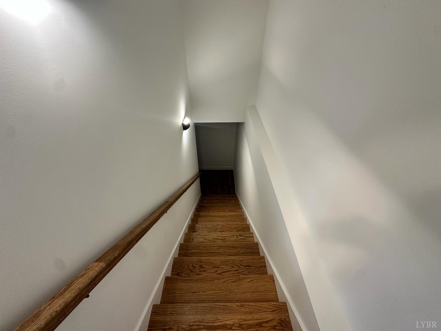 11314 Leesville Road Evington, VA 24550 - Photo 19 of 28 a view of a hallway with wooden floor and staircase