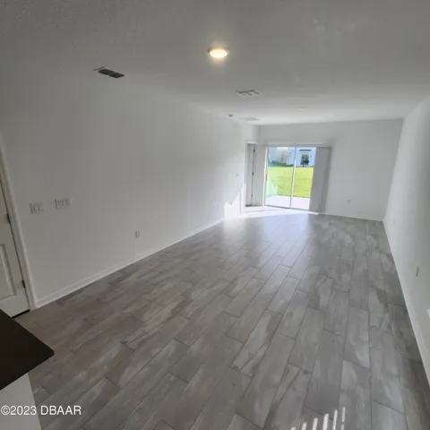 a view of room with wooden floor and window