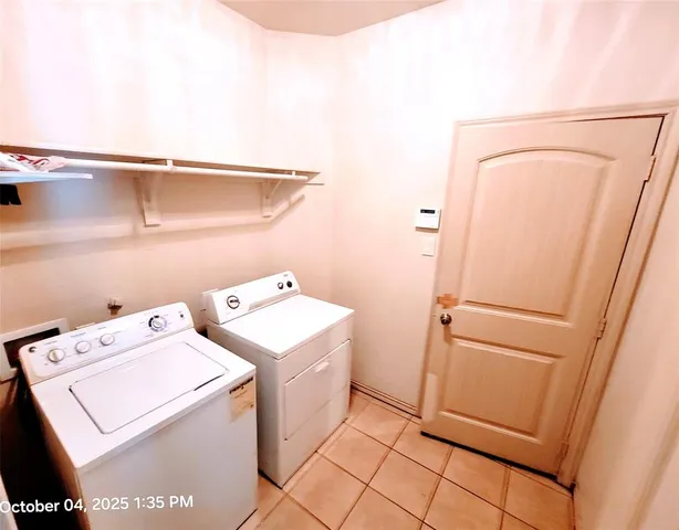 a bathroom with a granite countertop sink toilet and mirror