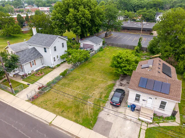 an aerial view of a house with a garden potted plants