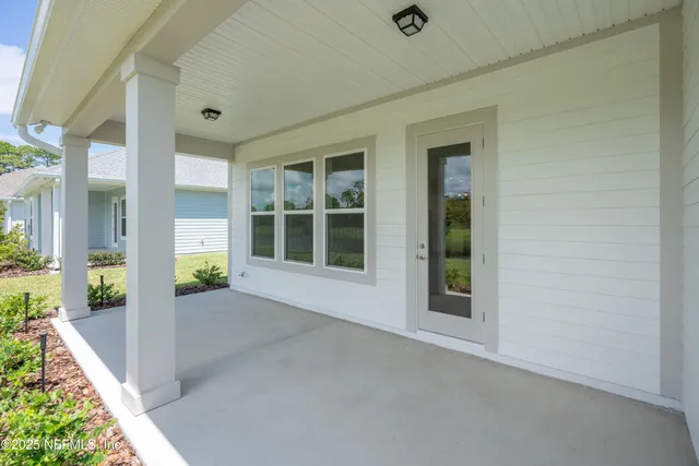 a kitchen with a sink appliances and cabinets