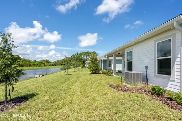 a kitchen with stainless steel appliances granite countertop a sink stove and white cabinets