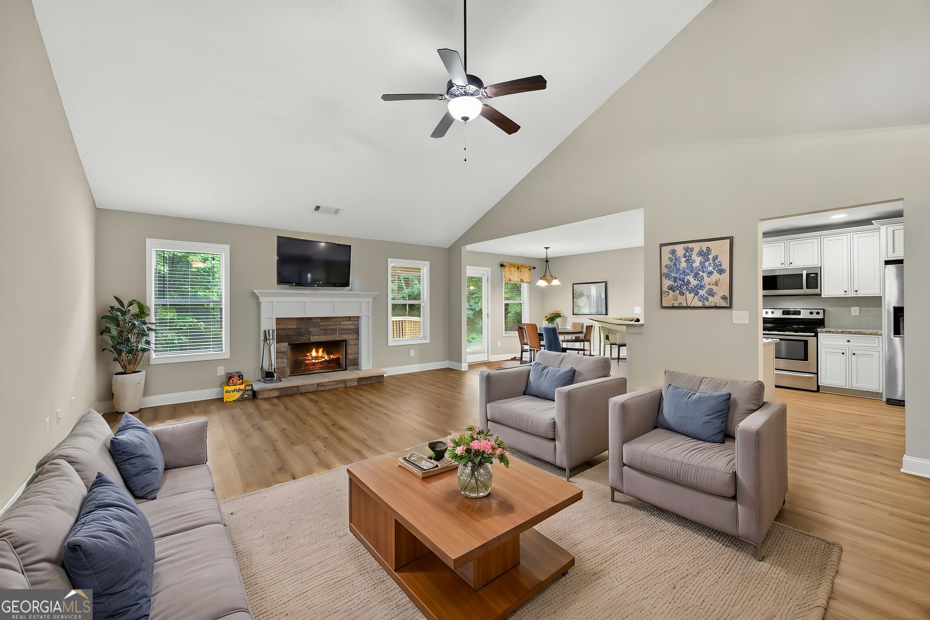 717 Oconee Lane Commerce, GA 30529 - Photo 45 of 57 a living room with furniture and a fireplace