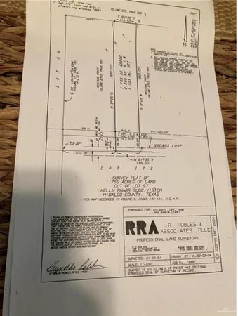 an aerial view of swimming pool with a lawn chairs