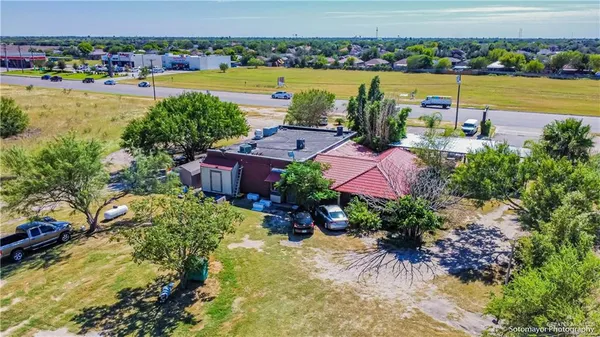 a swimming pool with outdoor seating and yard