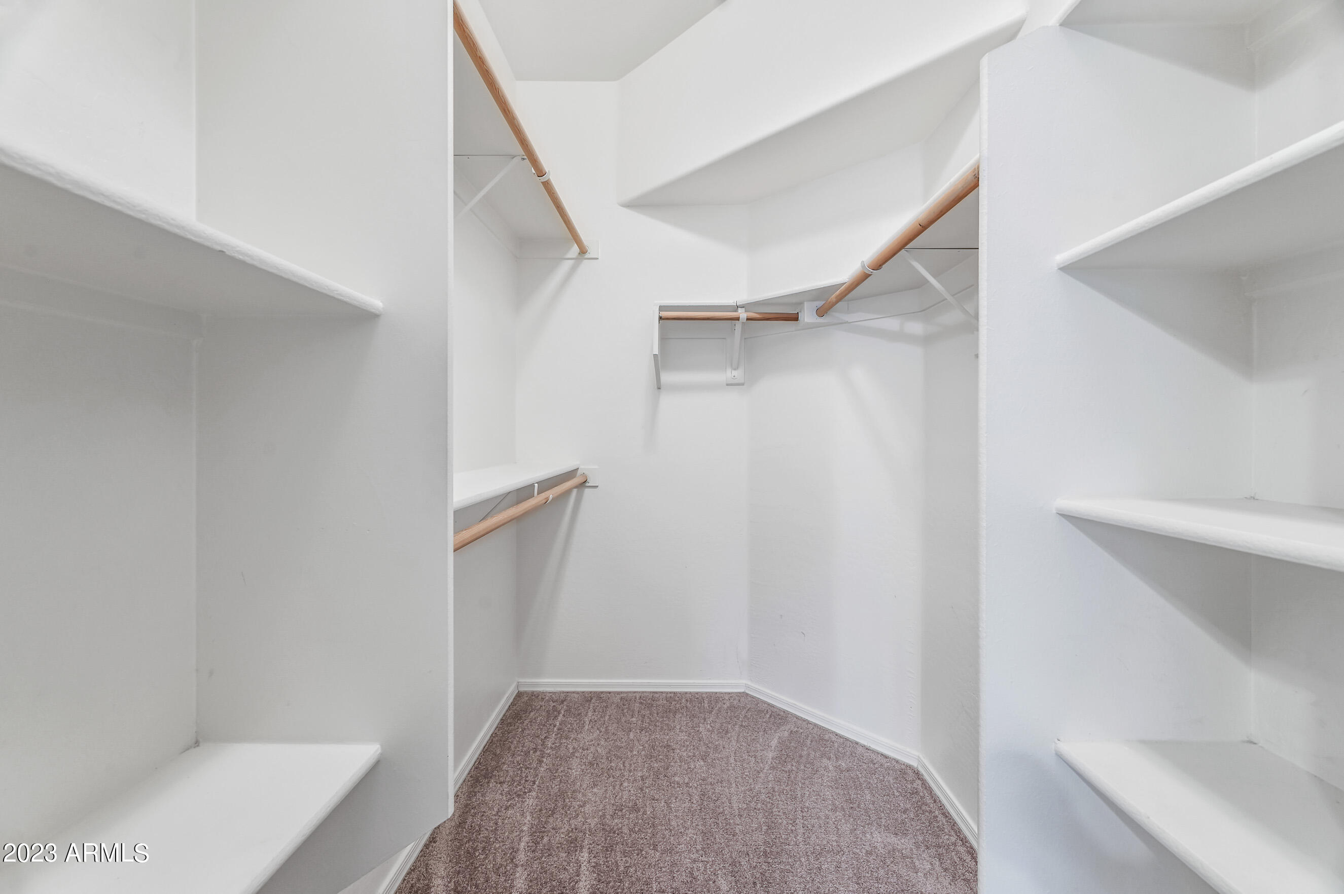 3145 South Eugene Mesa, AZ 85212 - Photo 13 of 20 a view of walk in closet with empty racks