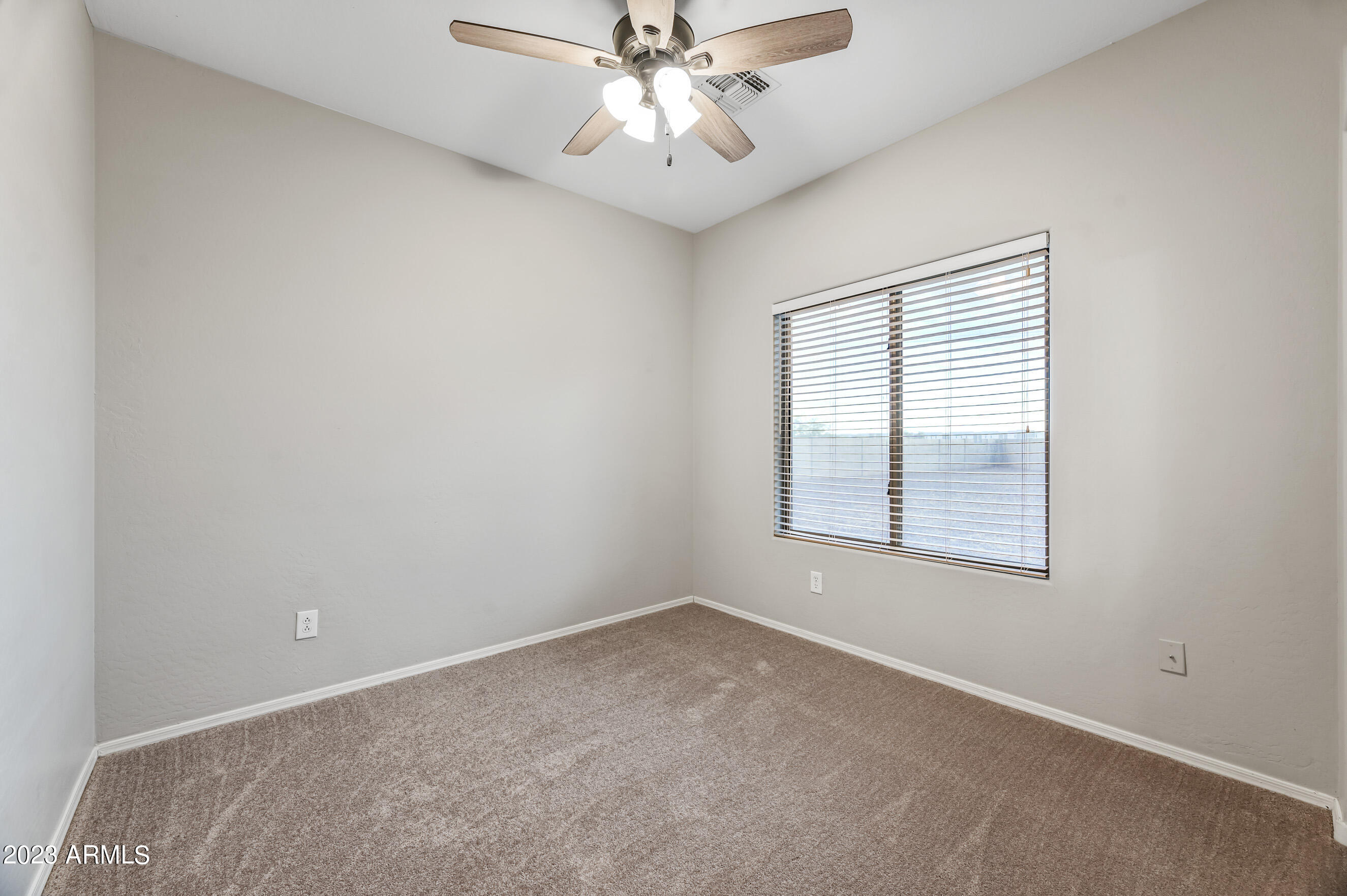 3145 South Eugene Mesa, AZ 85212 - Photo 15 of 20 an empty room with windows and fan