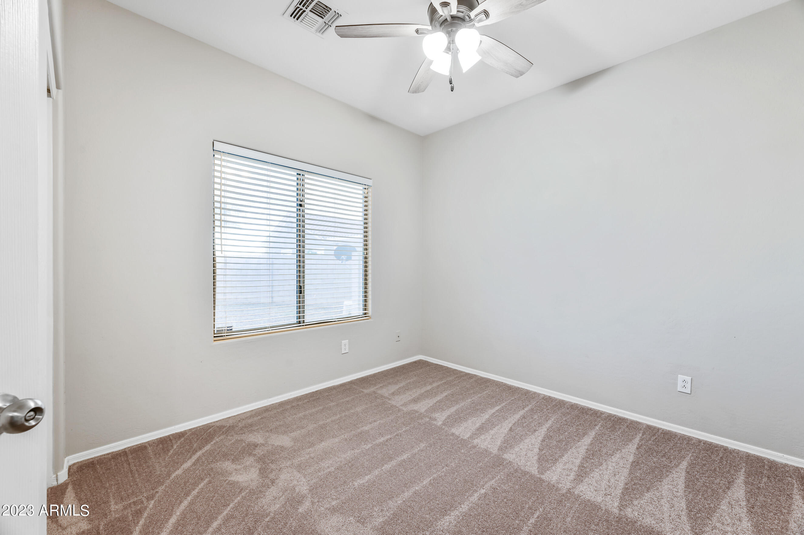 3145 South Eugene Mesa, AZ 85212 - Photo 16 of 20 an empty room with a window