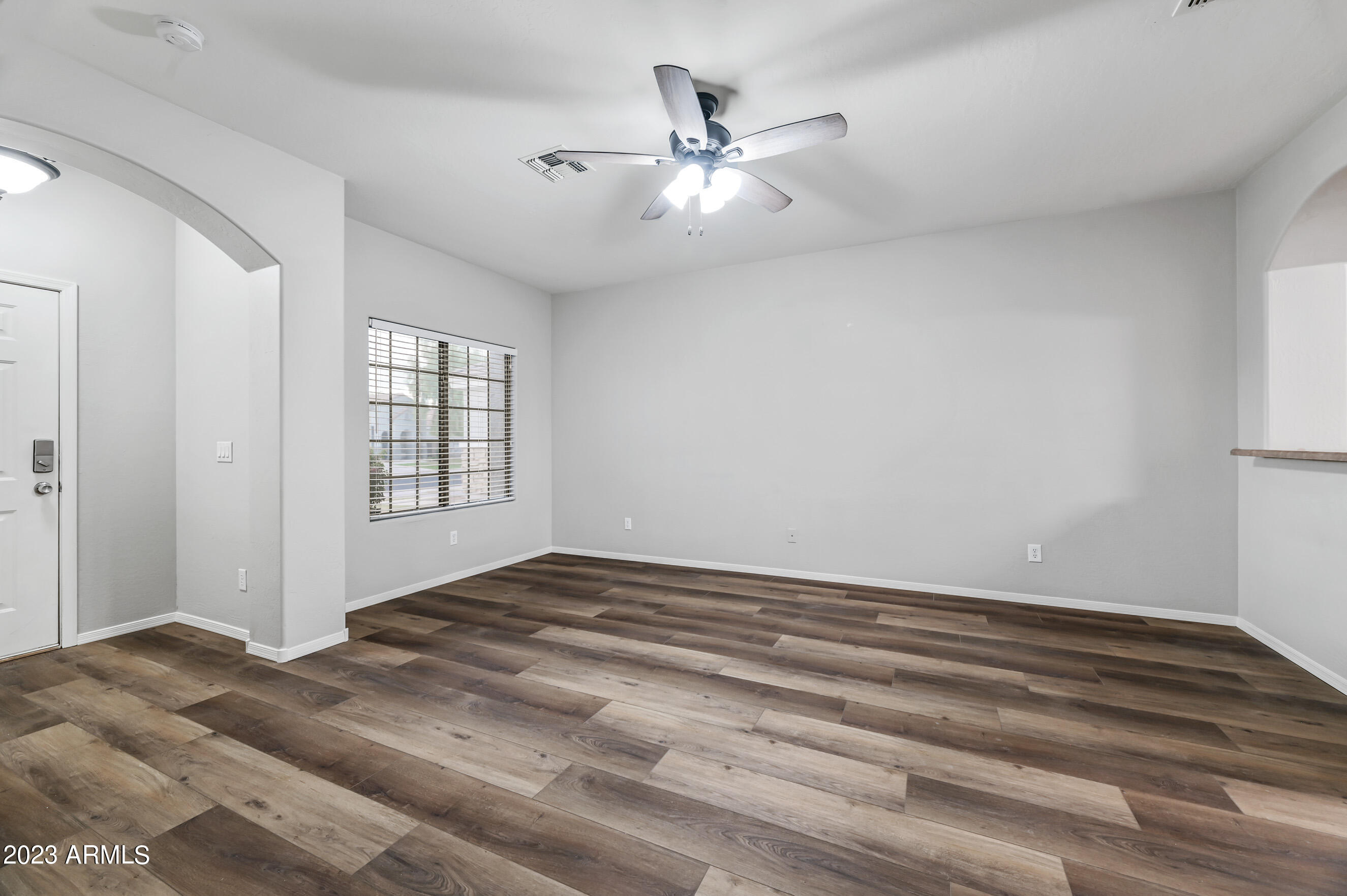 3145 South Eugene Mesa, AZ 85212 - Photo 3 of 20 a view of a livingroom with a ceiling fan and window