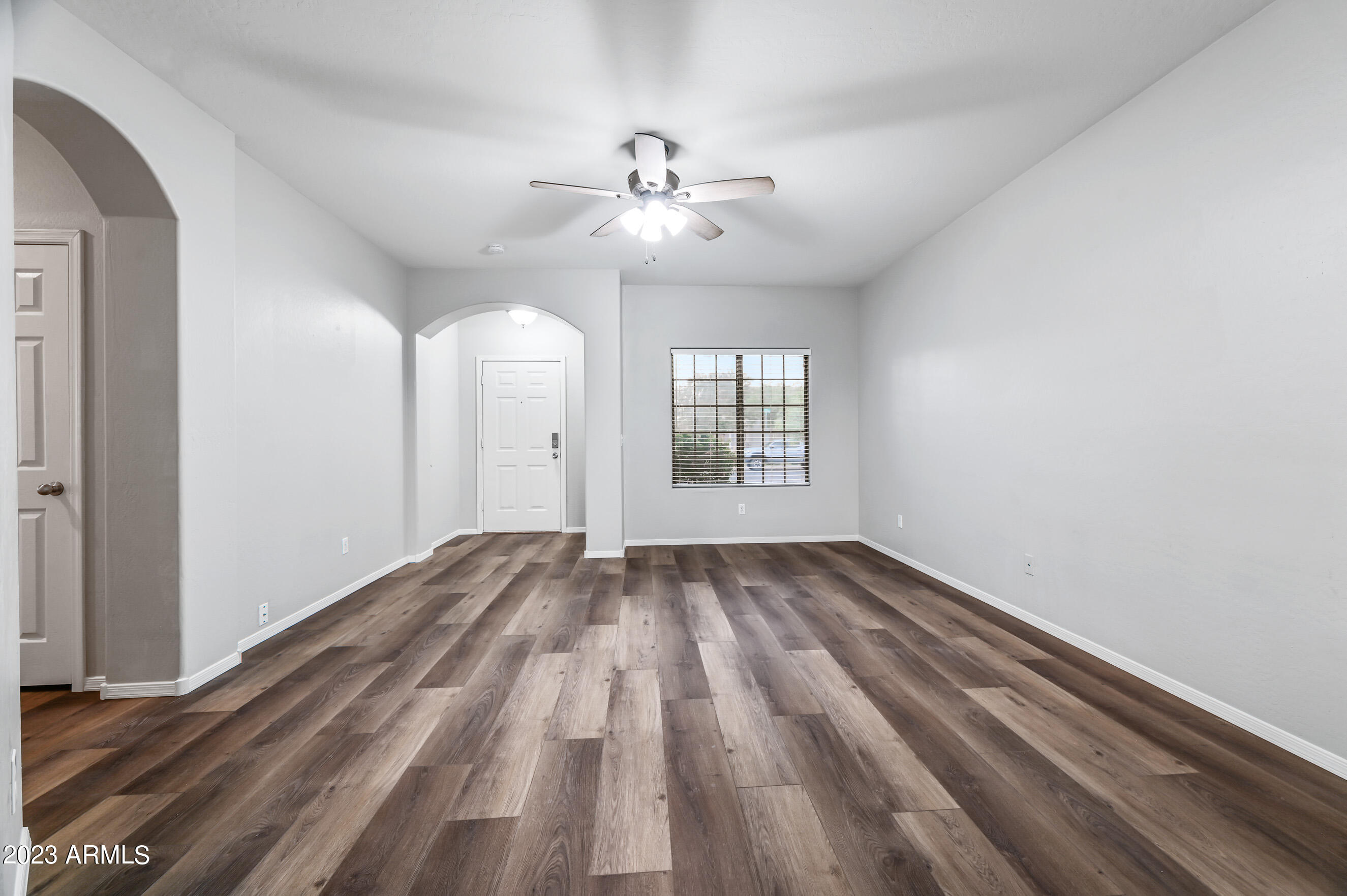 3145 South Eugene Mesa, AZ 85212 - Photo 4 of 20 a view of empty room with wooden floor and fan