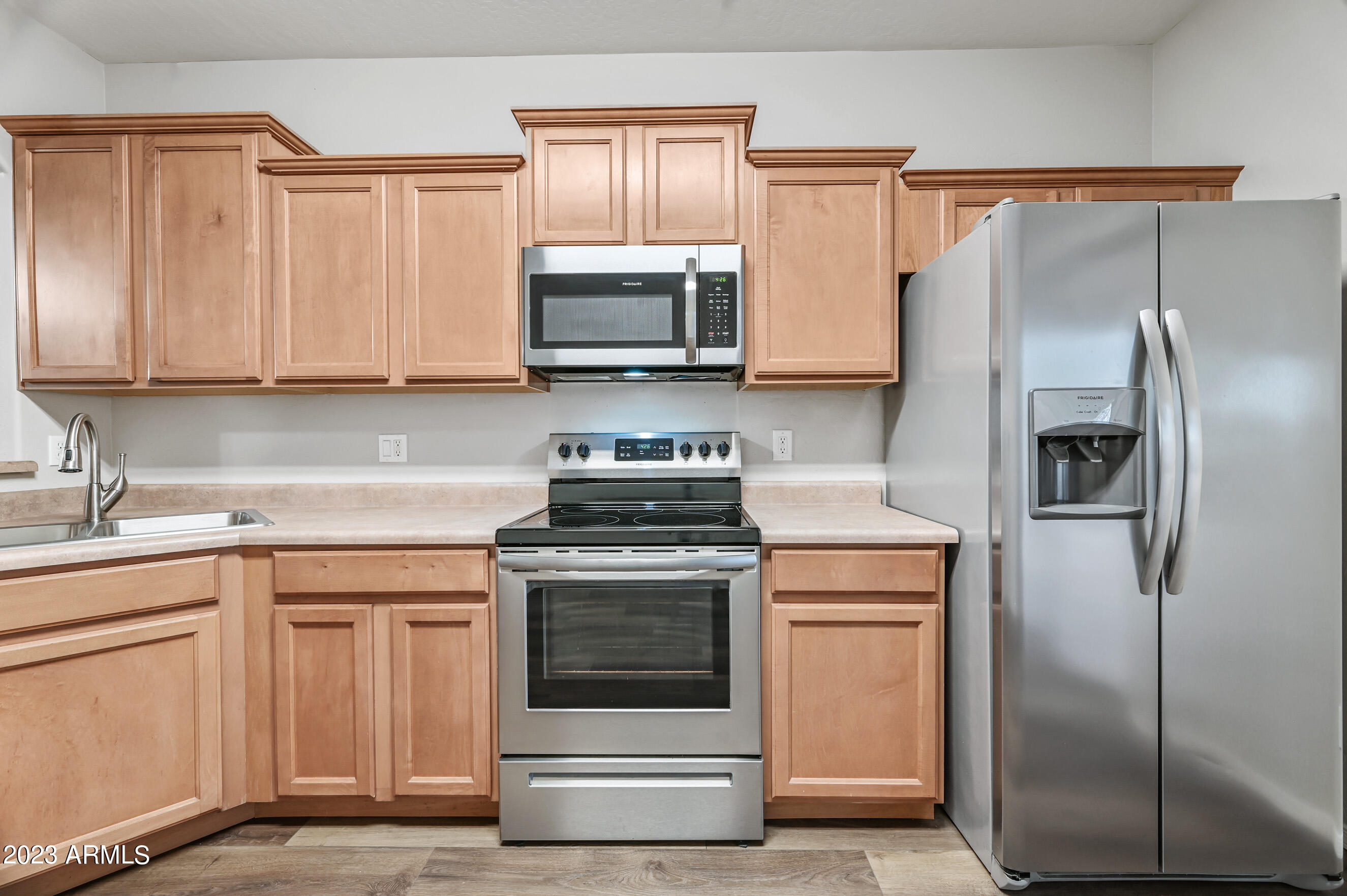 3145 South Eugene Mesa, AZ 85212 - Photo 6 of 20 a kitchen with a stove microwave and refrigerator